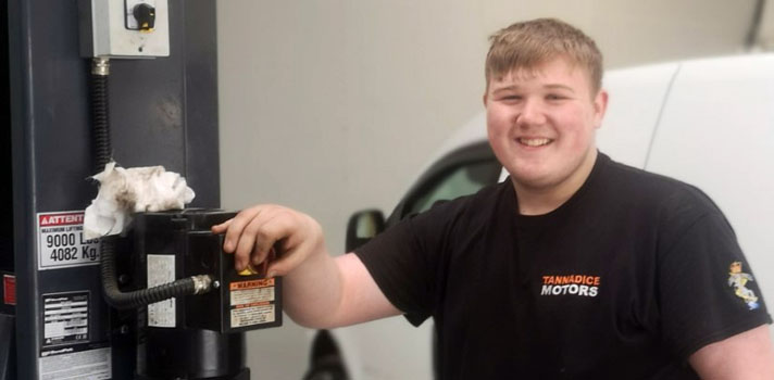 Young man working in a garage